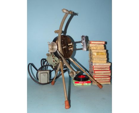 A Pathéscope Princess film projector, seventeen Pathéscope and Peak film reels, mainly comedy farces and two other films. 