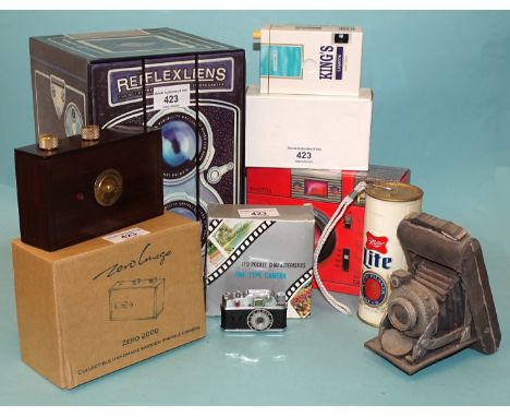A "Zero Image" handmade wooden pinhole camera, (boxed), a novelty camera cigarette lighter, three novelty cameras, a camera o