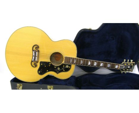 2001 Gibson SJ-200 acoustic guitar, natural finish with some light blemishes, pick wear to the scratchplate, very minor dent 