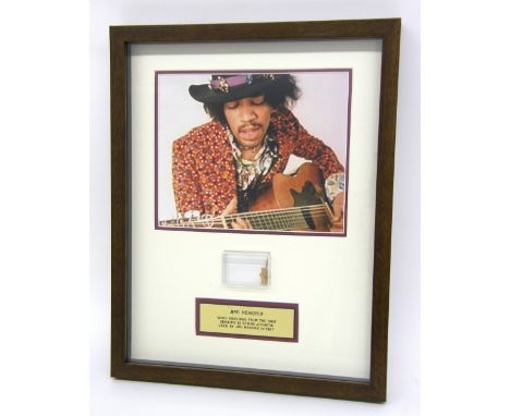 Jimi Hendrix - wood shavings from the 1960s Zemaitis 12 string acoustic guitar used by Jimi Hendrix in 1967, framed, with cer
