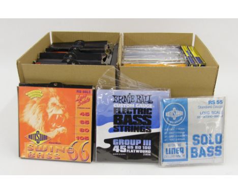 Quantity of miscellaneous bass guitar strings to include nine sets of Ernie Ball custom gauge flat wound and fourteen sets of