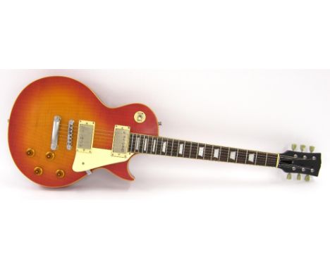 'Les Paul' style electric guitar, probably by Vintage, removed headstock decal, cherry sunburst finish with light surface imp