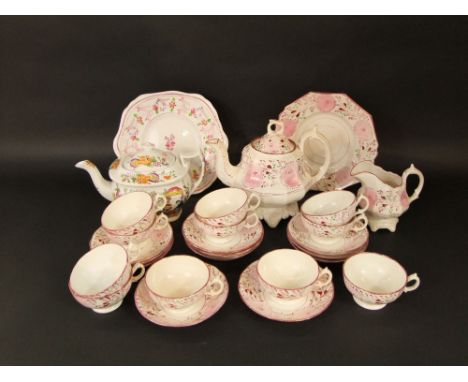 A collection of Victorian pink lustred teawares comprising teapot, milk jug, cake plate, 11 cups and 11 saucers, together wit