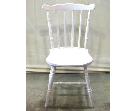 A set of four Windsor style stick back dining chairs with painted finish