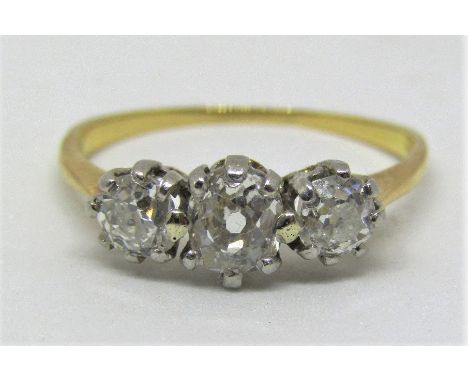 Good three stone diamond ring, centre stone 0.35cts approx, yellow metal unmarked, size K, 2.1g