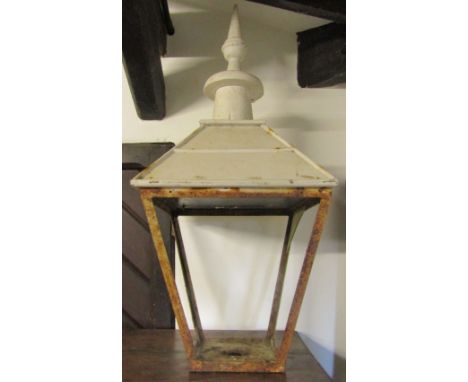 A 19th century iron work and timber street lantern hood, of square tapering form with painted roof and finial