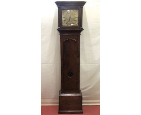 An early Georgian oak countrymade longcase clock, the trunk enclosing a full length door enclosing a glass lenticle and 26 sq