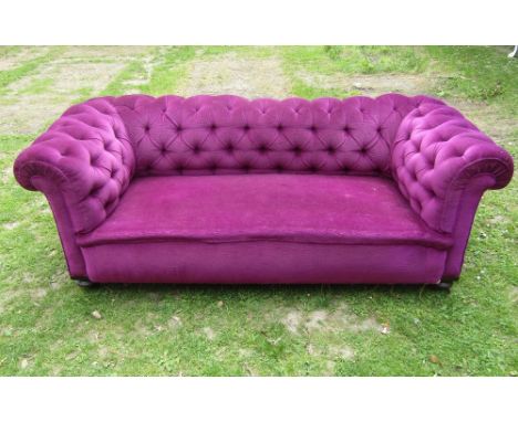 A small Victorian button back Chesterfield sofa with reupholstered finish on turned supports, 180 cm wide