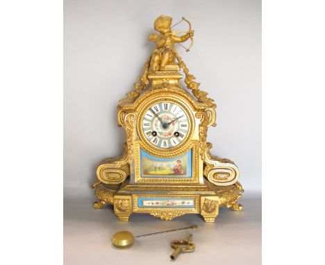 French gilt metal figural mantel clock, mounted by Cupid with Sevres type porcelain panels and dial, fitted with a two train 
