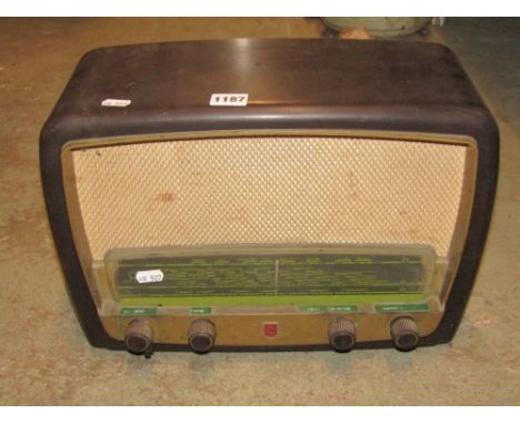 A Phillips vintage valve radio with Bakelite case, exterior lantern with iron work bracket, a game crown, two brass trivets, 