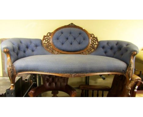 A Victorian walnut parlour room sofa, the cameo back within a carved and pierced framework with upholstered and buttoned fini