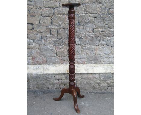 A 19th century mahogany torchere with carved detail and tripod base, together with a circular mahogany occasional table or bo