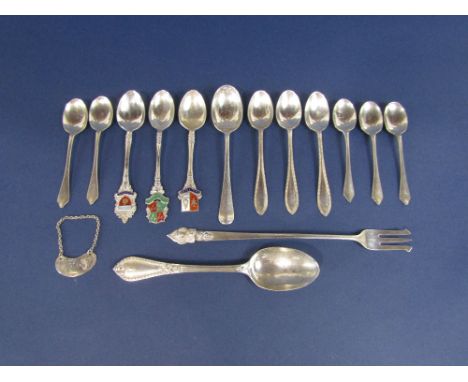 A mixed collection of various silver tea spoons to include enamelled crested examples, together with a further eastern white 