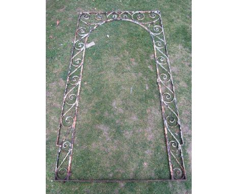 A decorative iron work garden gate framework with repeating scroll surround to house an arched gate 212 cm high x 117 cm wide