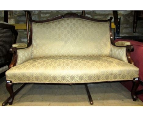 An Edwardian drawing room sofa with carved and moulded showwood frame and upholstered framework on shaped forelegs, 125cm wid