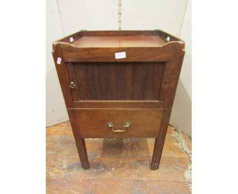 A Georgian mahogany tray top commode, the front elevation enclosed by a tambour front and frieze drawer, 50cm wide