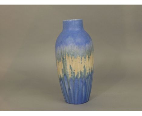 A Ruskin pottery vase by William Howson Taylor, with iron filing frosted type detail on a mottled blue and yellow ground and 