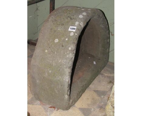 A weathered natural stone D shaped trough 56 cm wide x 43cm deep x 20 cm height approx