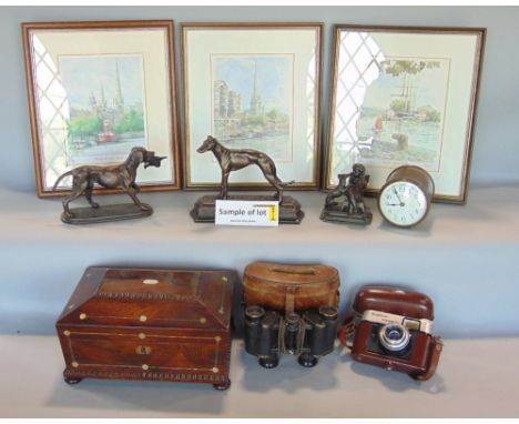 A box of interesting items to include bronze resin figures, a rosewood sarcophagus box, a drum head time piece, binoculars, p