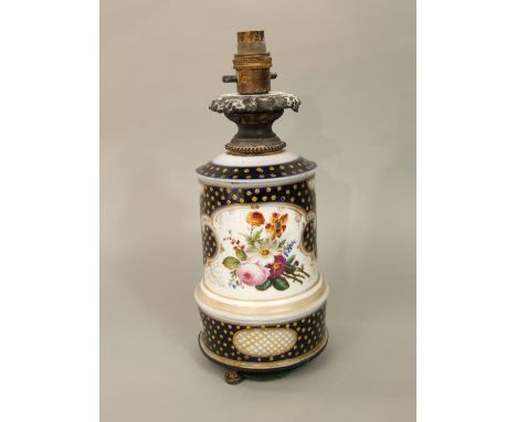 A 19th century blue ground ceramic oil lamp base with painted floral sprays and gilt spotted decoration, with cast metal frui