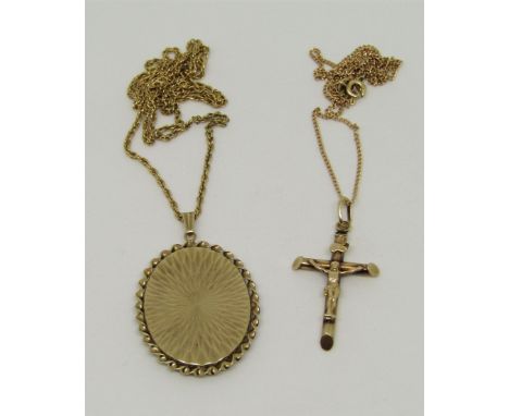 Two 9ct fine link pendant necklaces; the first an engine turned locket hung on a rope twist chain, the other with crucifix pe