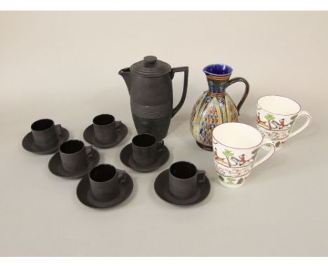 A Keith Murray black basalt coffee pot, six Wedgwood black basalt coffee cans and saucers, together with a Doulton Lambeth ju