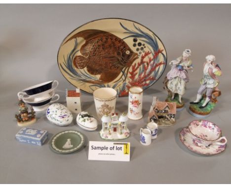 A 19th century Berlin porcelain cup and saucer with painted flower basket and insect decoration and KPM printed mark to base,