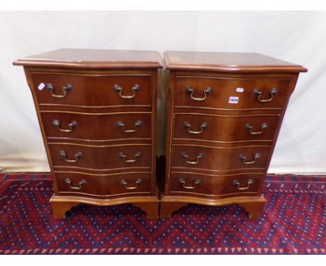 A pair of Georgian style yew wood veneered serpentine chests of four drawers on bracket supports, 47 cm 