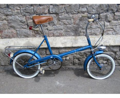 A vintage Raleigh RSW16 bicycle with metallic blue tubular frame, Sturmey Archer three speed