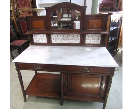 A good quality Victorian mahogany marble top washstand, the base partially enclosed by a single panelled door and two drawers