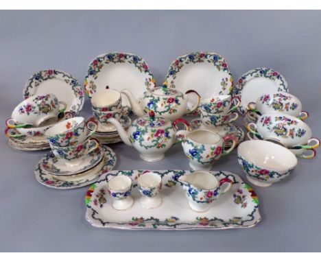 A collection of Royal Cauldon Victoria pattern wares comprising two tea pots, a milk and a cream jug, sugar bowl, a pair of c