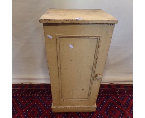 A Victorian painted pine pot cupboard enclosed by a single panelled door