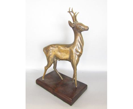 Cast bronze study of a standing deer upon a wooden plinth base, 25cm high