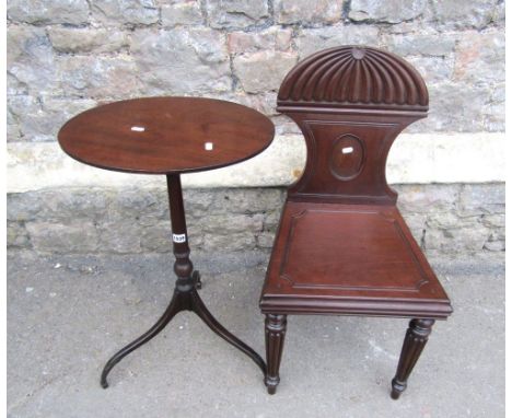 A Georgian mahogany light weight occasional table, the oval top raised on a slender vase shaped pillar and simple tripod base