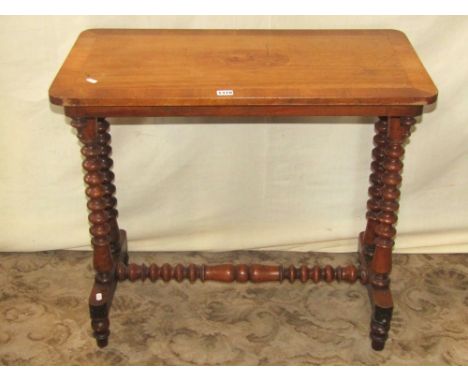 A Victorian walnut and marquetry occasional table of rectangular form raised on four bobbin supports with central rail, 76 cm