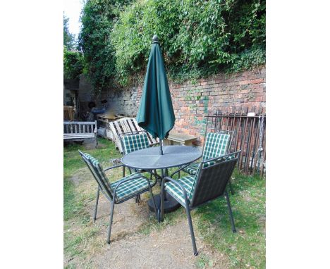 A contemporary powder coated light steel framed garden table of circular form, the pierced lattice top with central parasol h