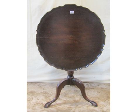 A 19th century snap top occasional table with pie crust borders raised on a turned and carved column and tripod base, togethe