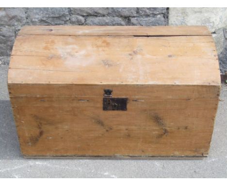 A 19th century stripped and waxed pine travelling trunk with domed lid