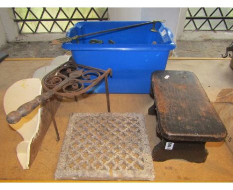 A collection of 19th century iron and brass architectural fittings including hooks, brass tie backs, brass handles, window fi