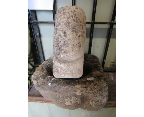An early carved stone mortar/quern of square form with central circular tapered cut out, together with a small architectural 