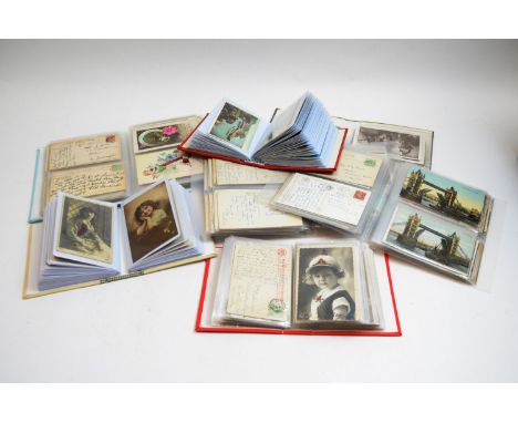 Three albums of early 20th Century postcards, many of famous actresses, approximately 150; an album of vintage Christmas/Birt