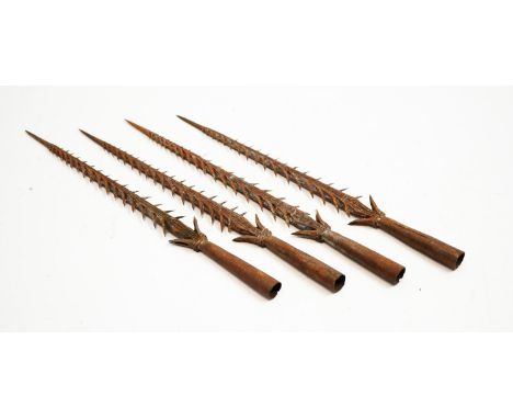 Four vintage steel fishing spearheads.