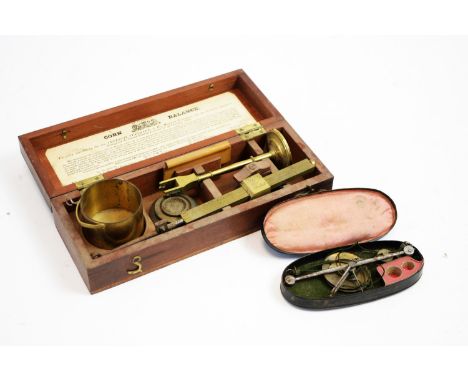 Dolland, London: a 19th Century lacquered brass corn balance, in mahogany box with hinged cover and paper label to the inner 