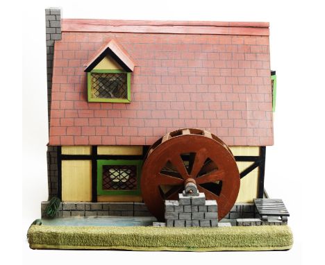A 20th Century scratch-built doll's Millhouse, with removable front section and roof revealing two ground floor and two attic