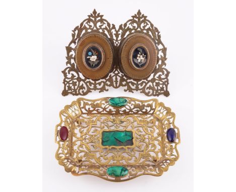 A VICTORIAN PIERCED BRASS AND PIETRA DURA INLAID DOUBLE PHOTOGRAPH FRAME, TOGETHER WITH AN ENGRAVED GILT-BRASS MALACHITE AND 