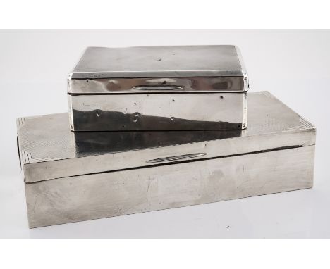 TWO SILVER TABLE CIGARETTE BOXES (2)The largest wooden lined within, the hinged lid engine turned, Birmingham 1935, size 20.5