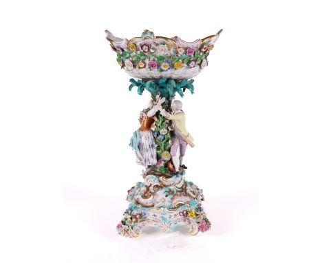 A MEISSEN PORCELAIN CENTREPIECE AND STAND (2)Late 19th centuryProbably outside decorated, modelled as a gallant chasing a you