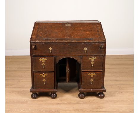 AN 18TH CENTURY OAK KNEEHOLE BUREAU87cm wide; 53cm deep; 94cm highCondition report:&nbsp;Various repairs and replacements, in