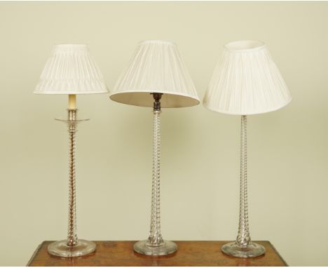 A PAIR OF SPIRAL TWIST GLASS TABLE LAMPS AND SHADES AND ANOTHER TABLE LAMP (3)Pair on circular bases, 72 cm high including sh