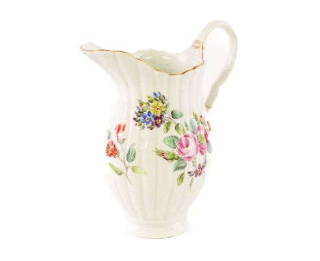 A WORCESTER POLYCHROME FLUTED MILK JUGCirca 1775Painted with scattered flowers beneath a gilt line rim, 12.5cm highRepairs to